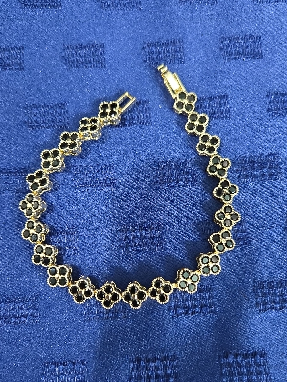 Gold-Tone Floral Link Bracelet with Black Accents